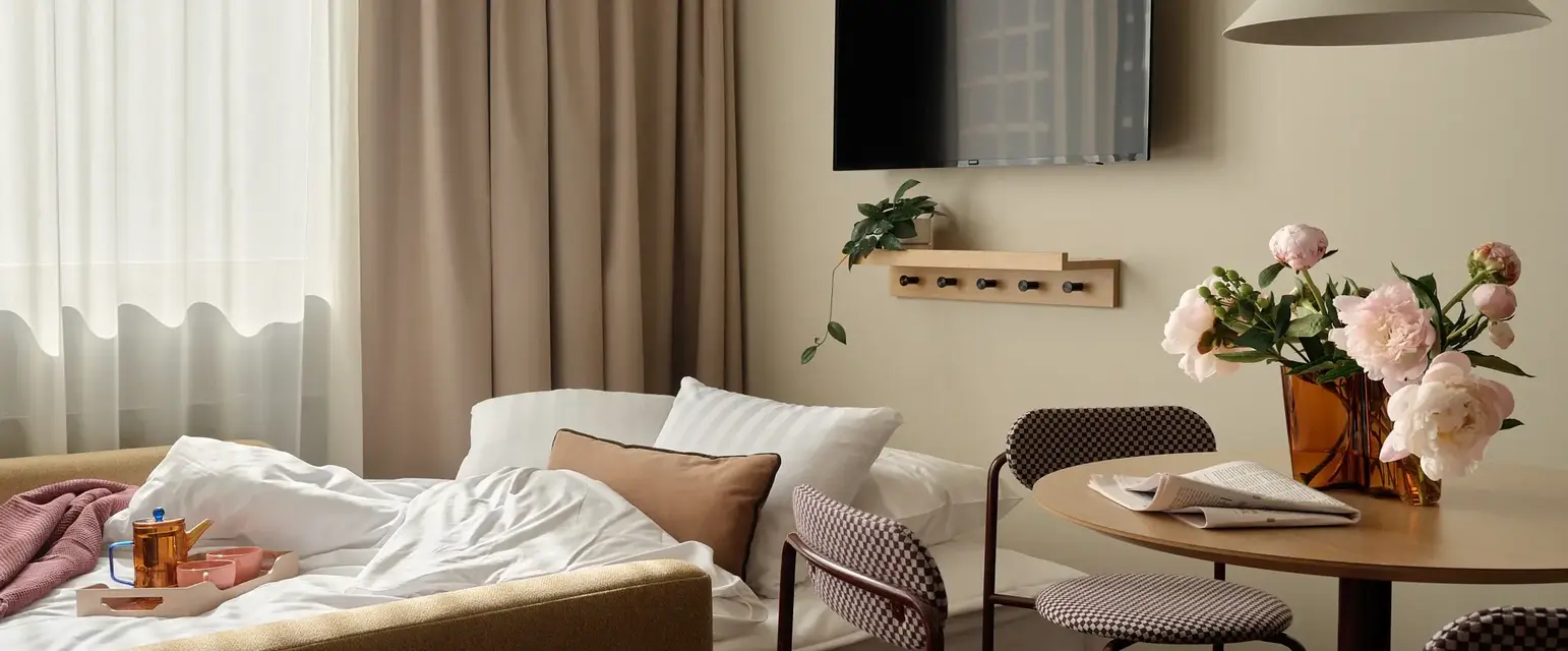 a room with a tv and a bed