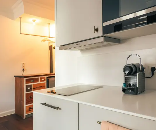 a kitchen with a microwave oven and a towel