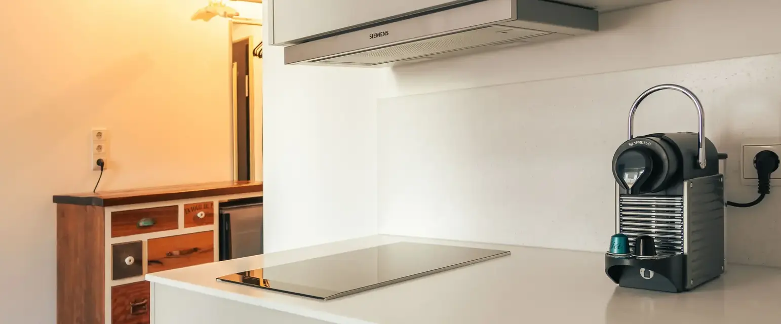 a kitchen with a microwave oven and a towel