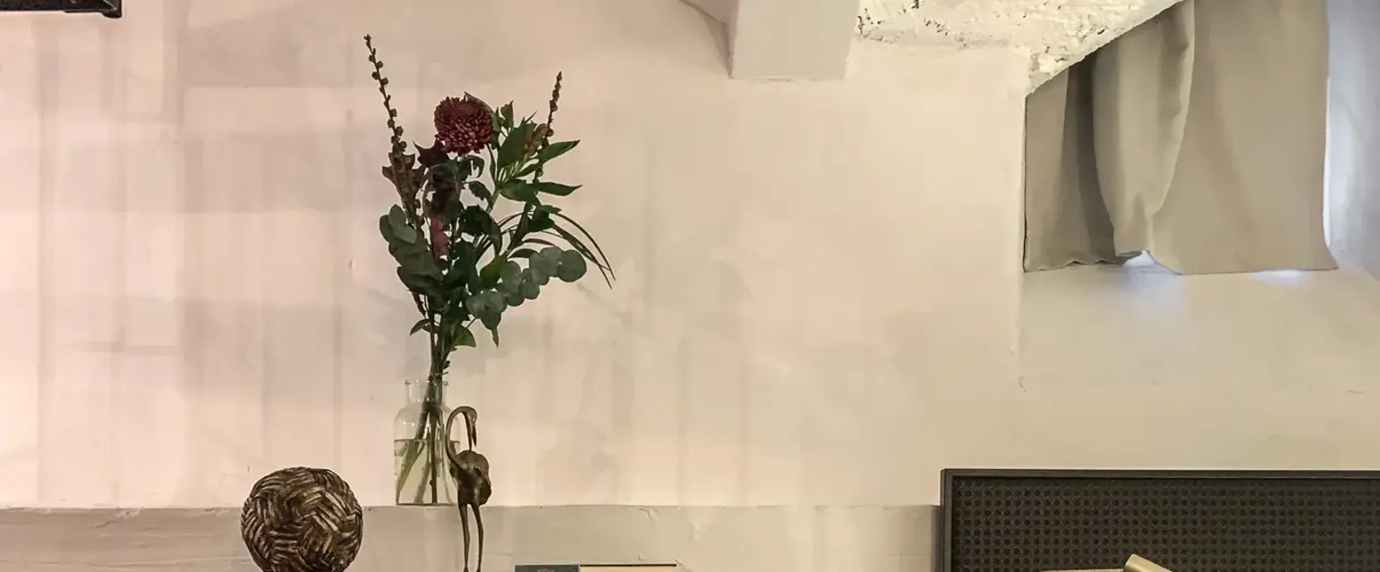 a room with a bed and a glass cabinet