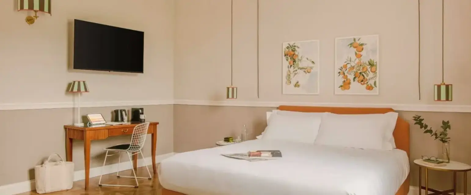 a bed with a tv and a table in a room