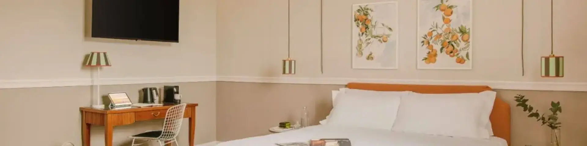 a bed with a tv and a table in a room