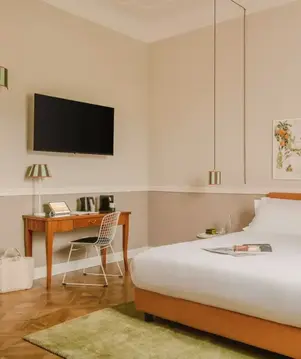 a bed with a tv and a table in a room