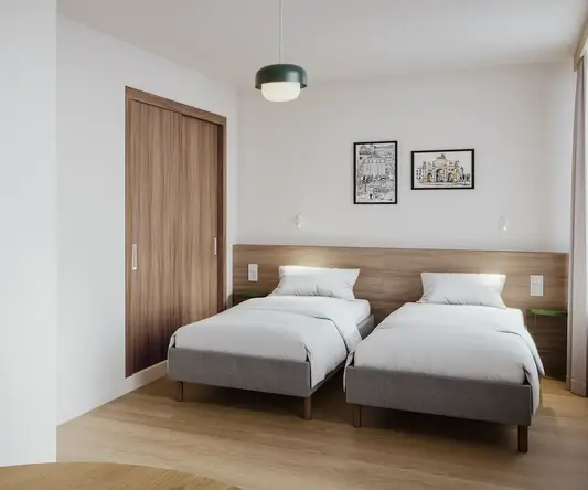 a room with two beds and a door