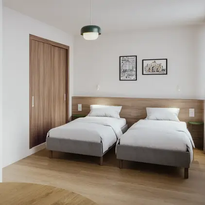 a room with two beds and a door