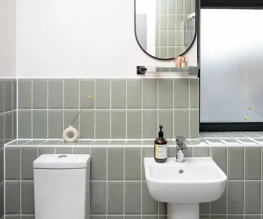 a bathroom with a sink and mirror