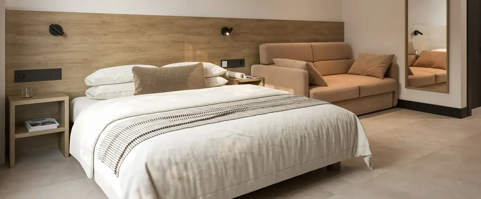 a bed and couch in a room
