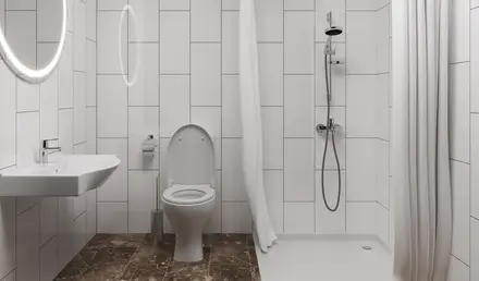 a bathroom with a shower and toilet