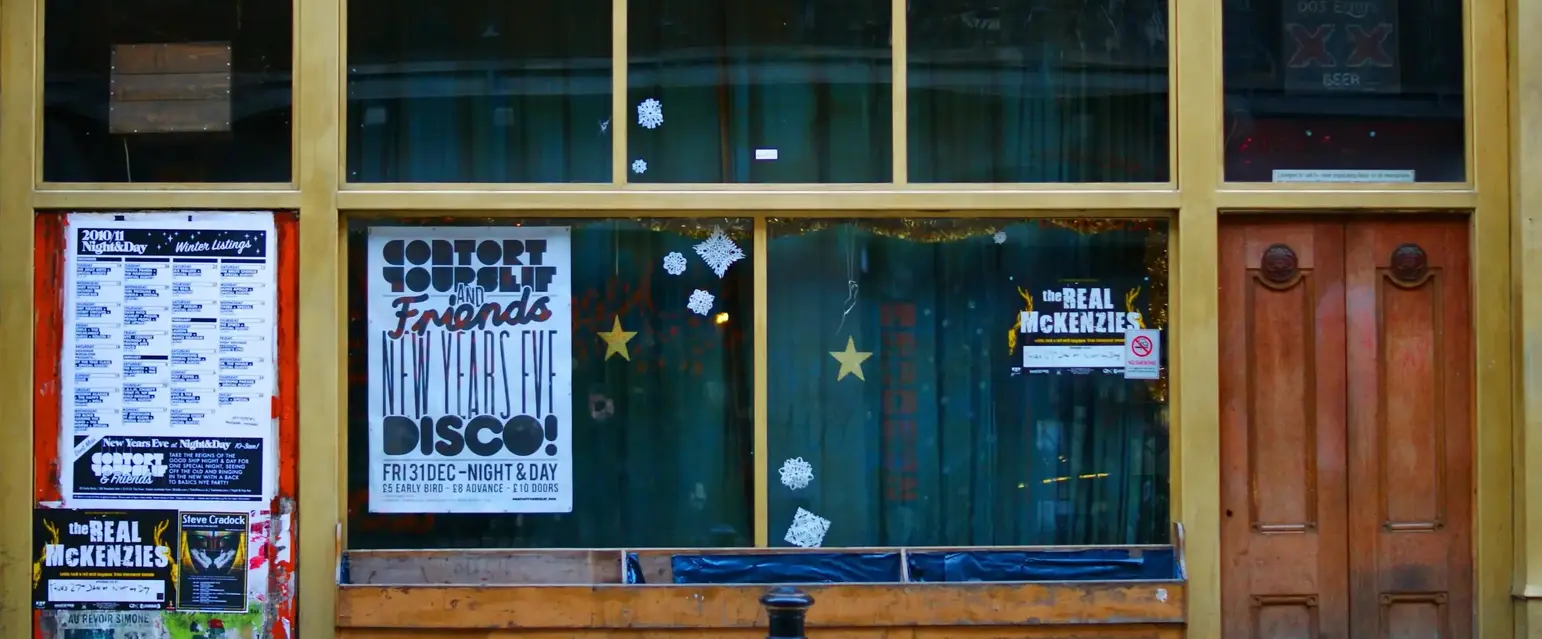 a store front with signs on windows