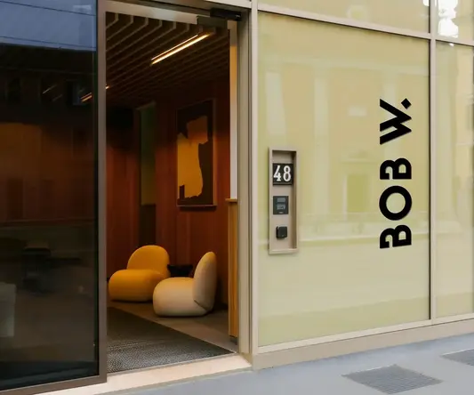 a glass door with a sign on the side of it