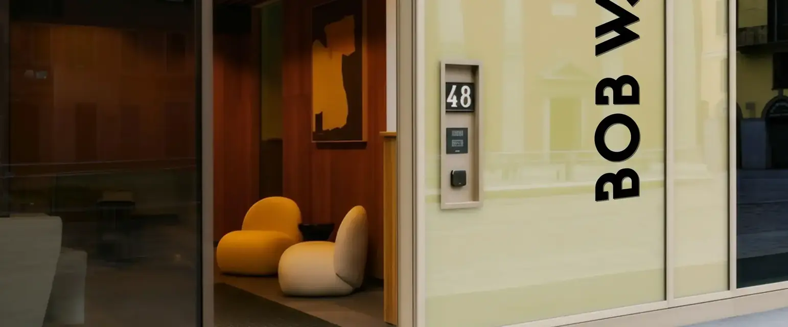 a glass door with a sign on the side of it