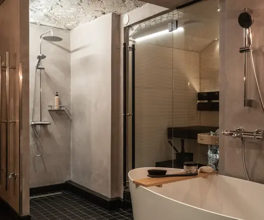 a bathroom with a shower and tub