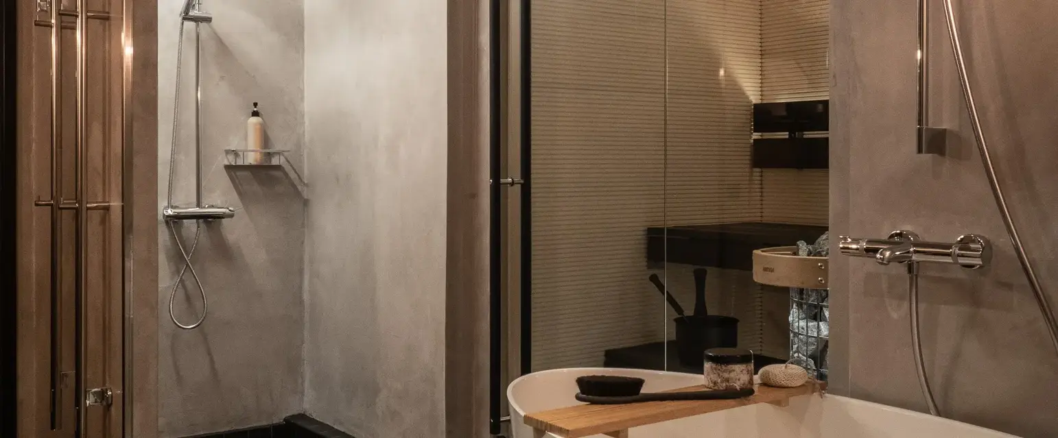 a bathroom with a shower and tub