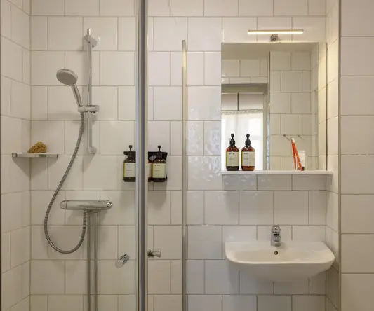 a bathroom with a sink and shower