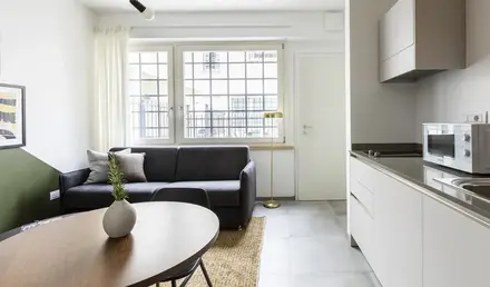 a living room with a couch and a table