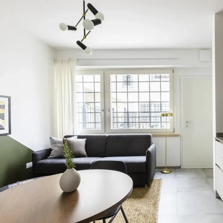 a living room with a couch and a table