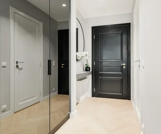 a hallway with a black door