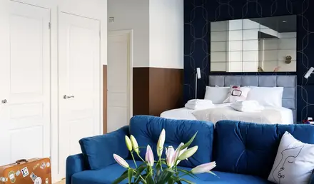 a room with a blue couch and a blue sofa