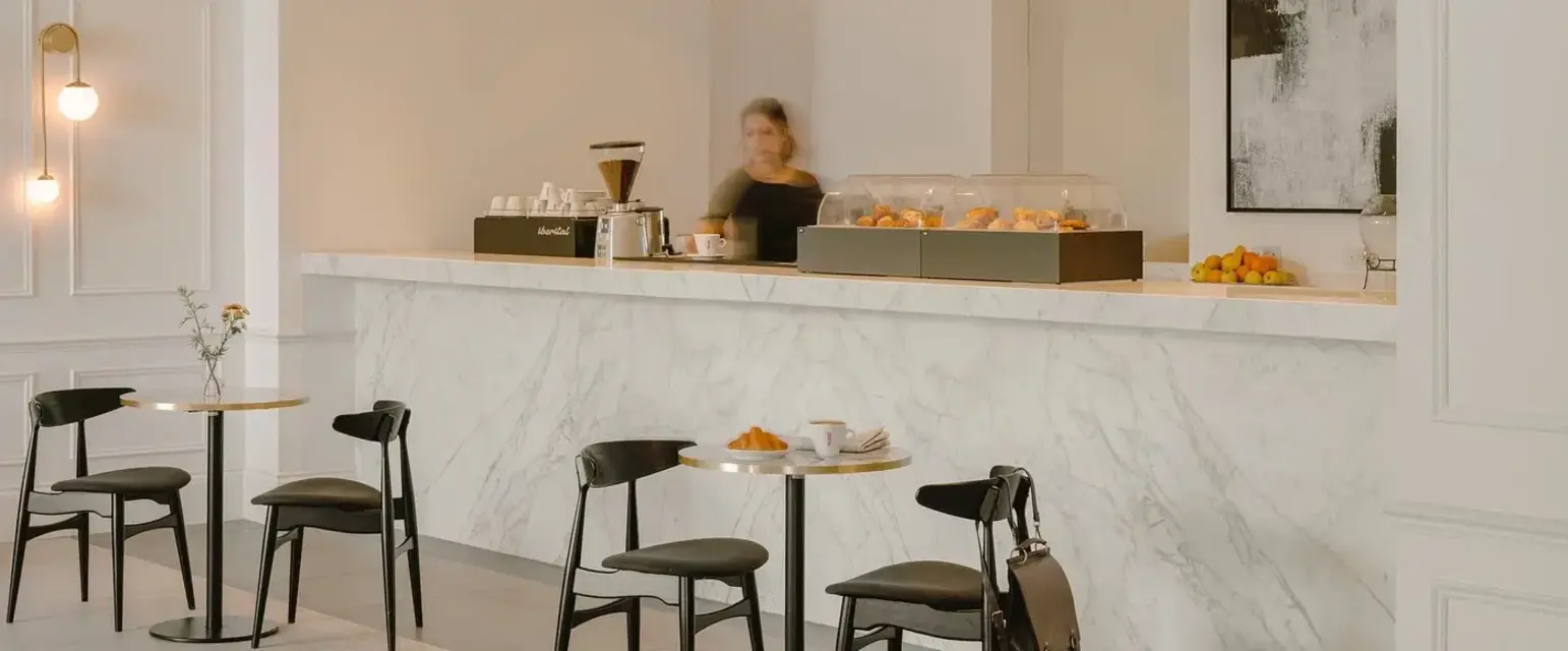 a counter with a person behind it