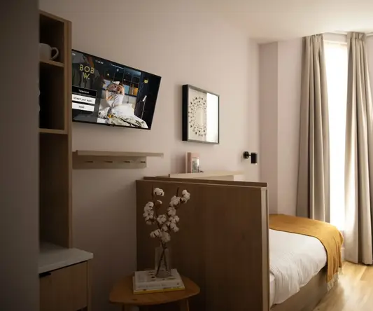a room with a tv on the wall