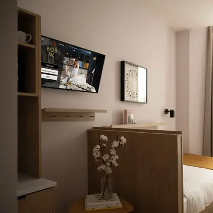 a room with a tv on the wall