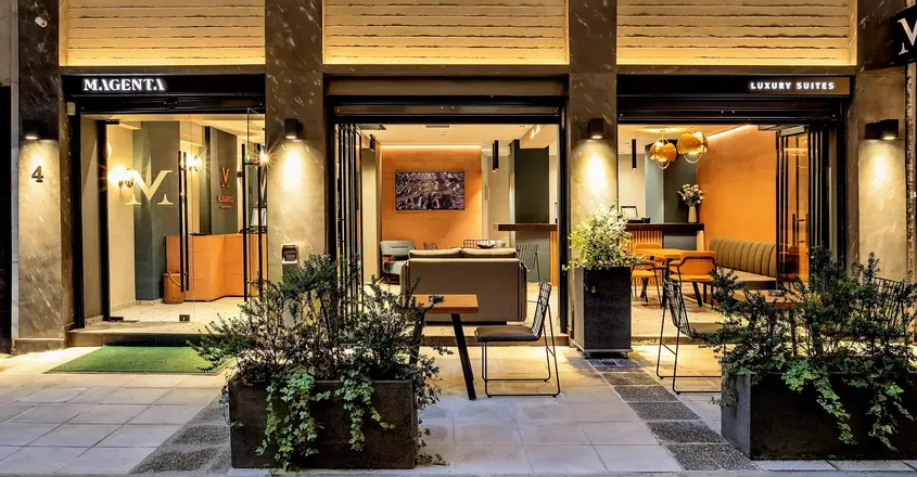 a building with a patio and tables