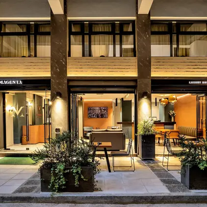 a building with a patio and tables