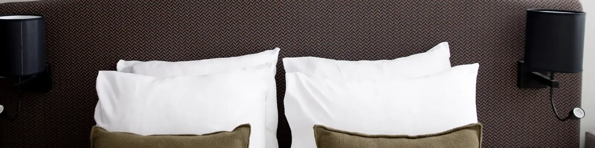 a bed with pillows on it