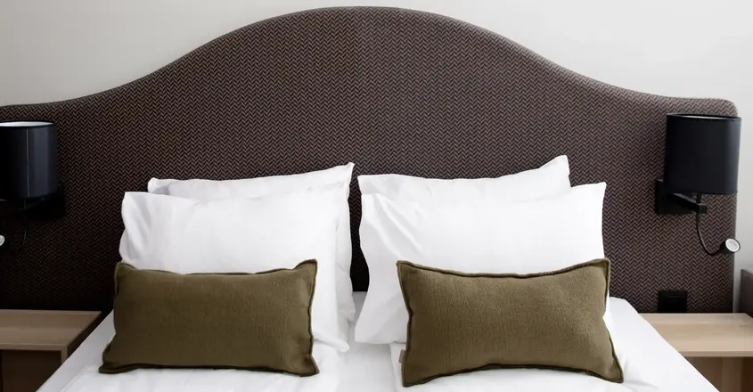 a bed with pillows on it