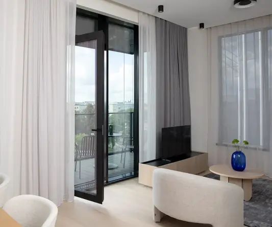 a room with a glass door and a table