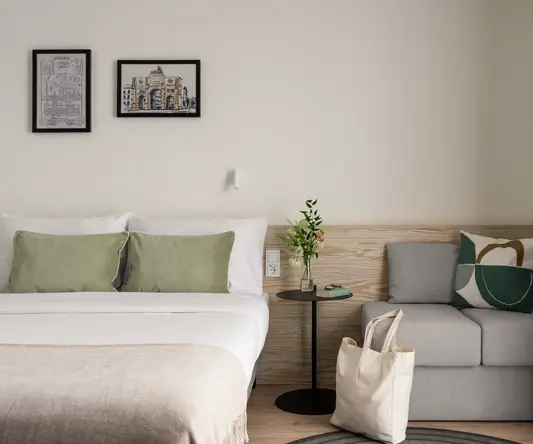 a bed and a couch in a room