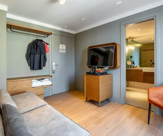 a room with a couch and a tv