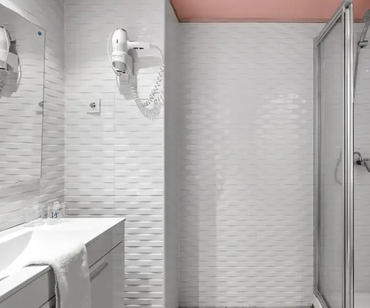 a bathroom with a shower and sink