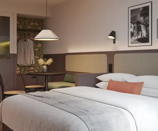 a bed with a table and chairs in a room