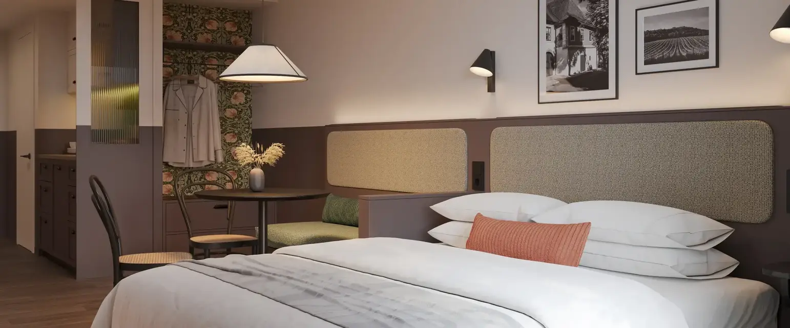a bed with a table and chairs in a room