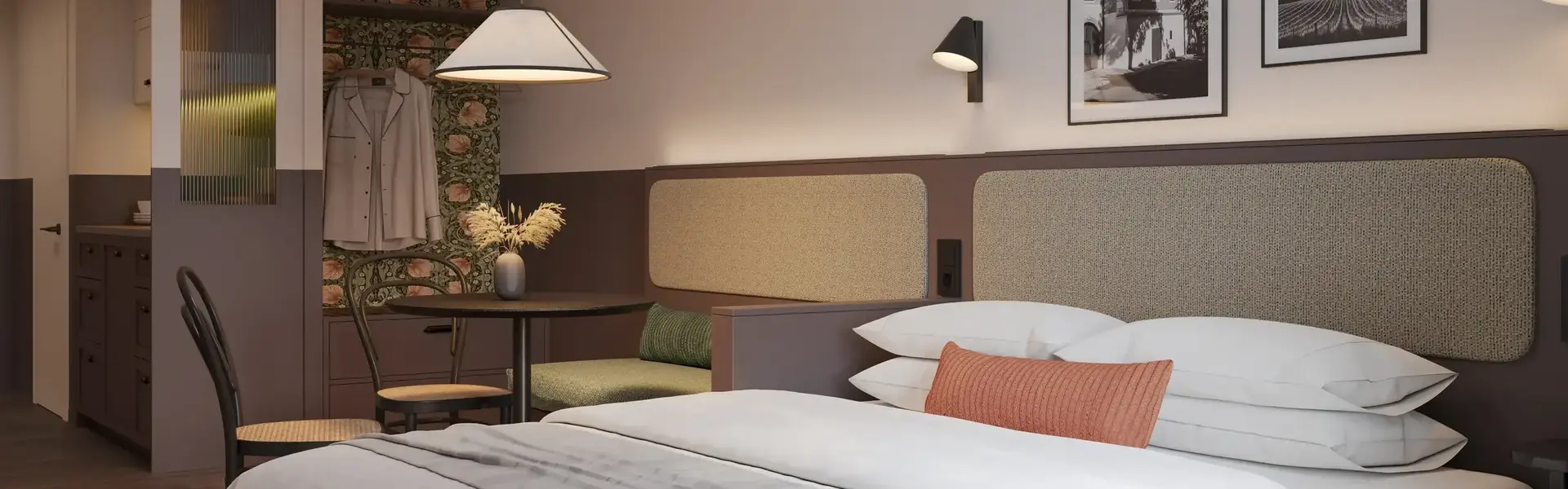 a bed with a table and chairs in a room