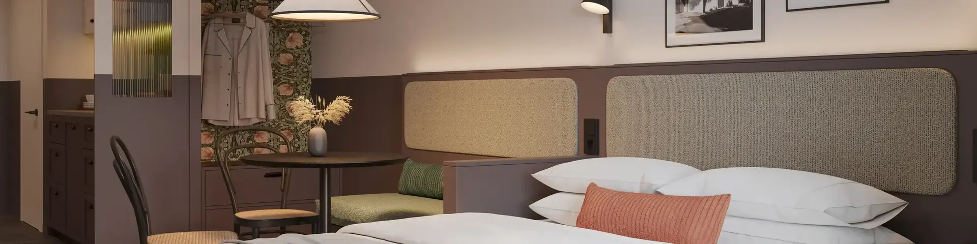a bed with a table and chairs in a room