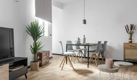 a dining room with a table and chairs