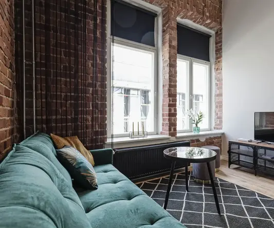 a living room with a couch and a tv