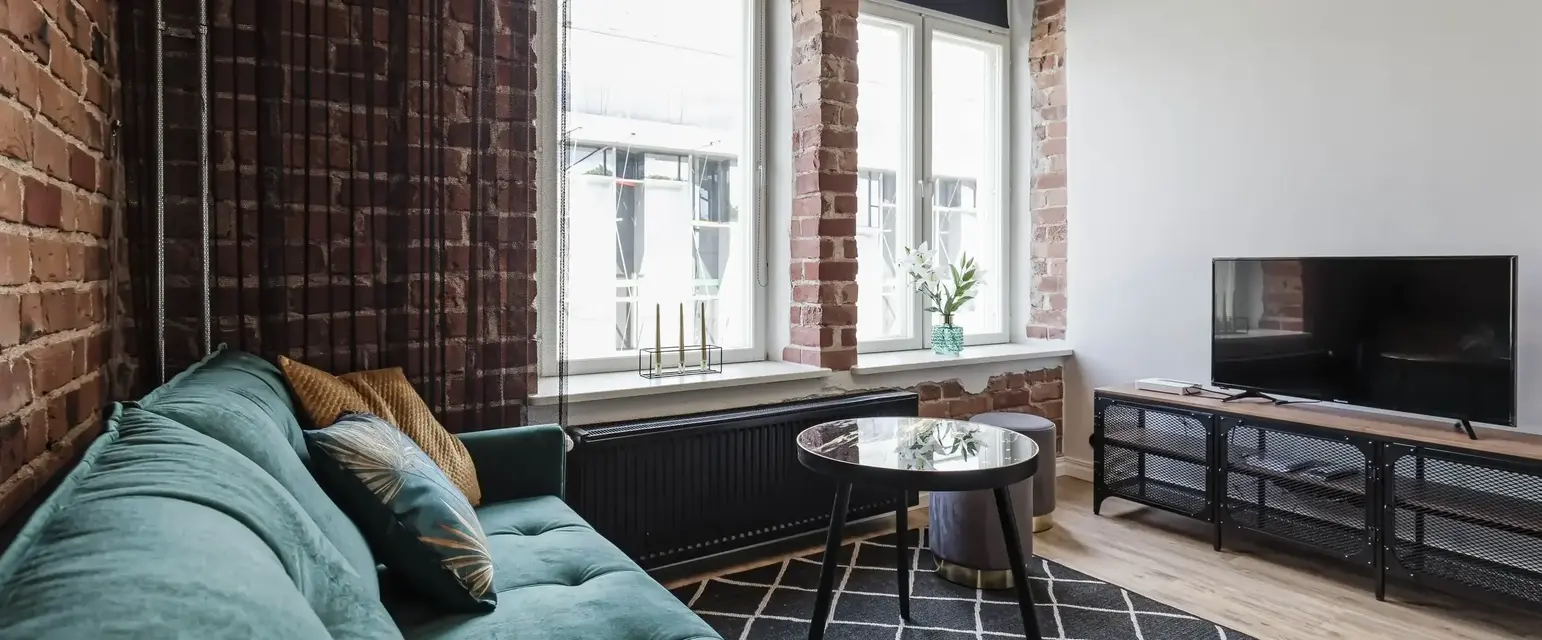 a living room with a couch and a tv