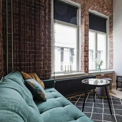 a living room with a couch and a tv