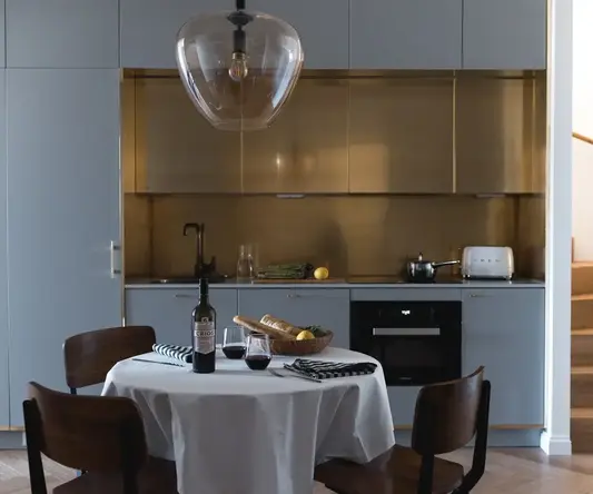 a table with a bottle of wine and a glass of wine on it