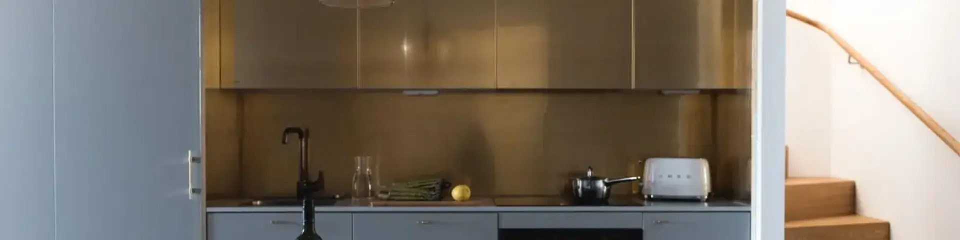 a table with a bottle of wine and a glass of wine on it