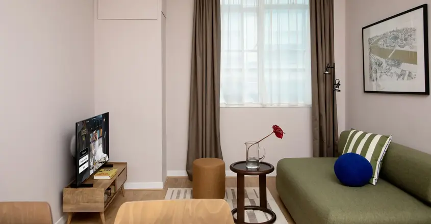 a room with a couch and a television