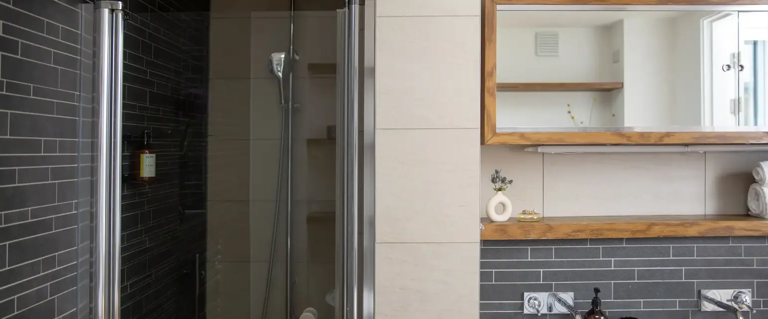 a bathroom with a shower and sink