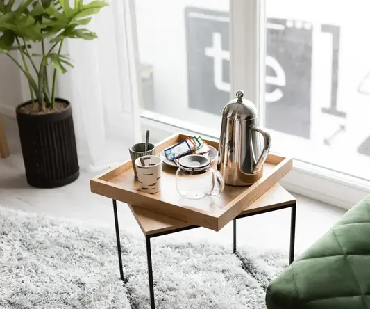 a tray with coffee cups and other objects on it