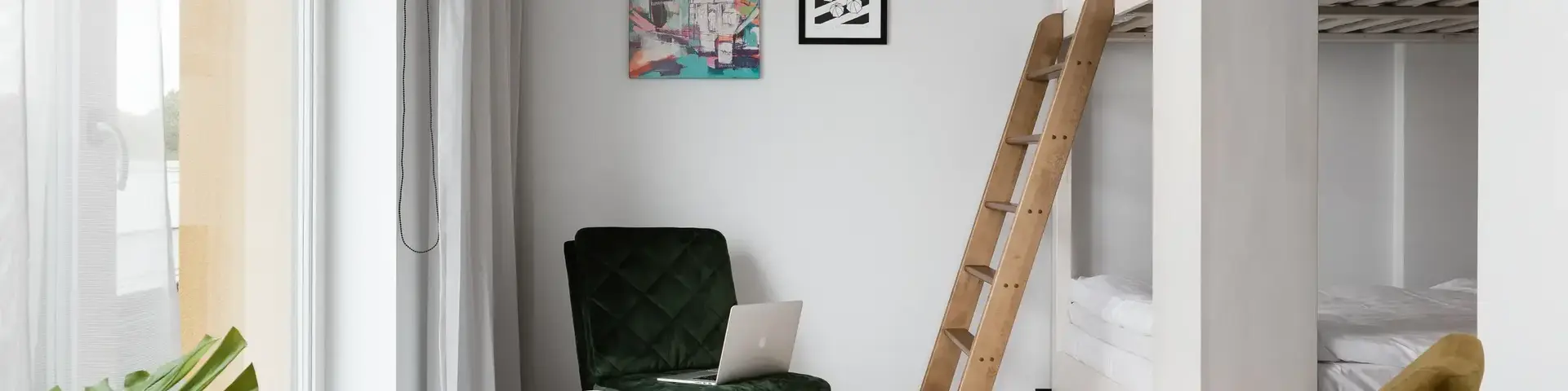 a room with a bunk bed and a chair