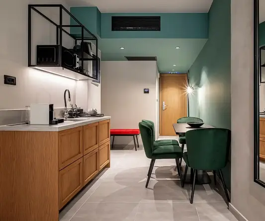 a kitchen with a table and chairs