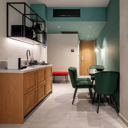 a kitchen with a table and chairs