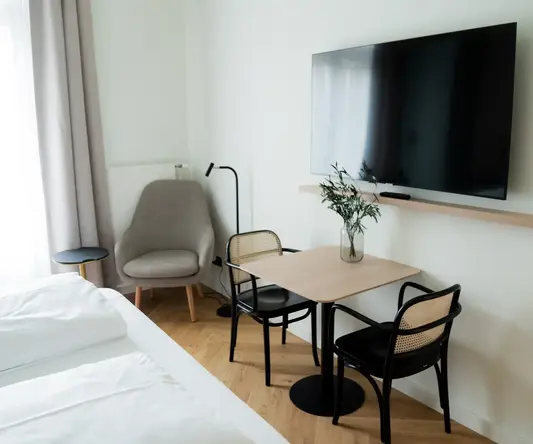 a room with a tv and table